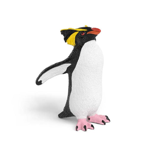 Schleich klipphopparpingvin figur med gula fjädertofsar och svartvit fjäderdräkt, realistisk modell av pingvin.