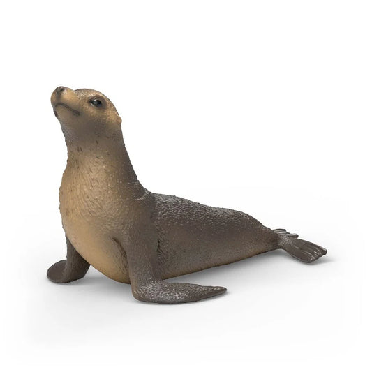 Schleich sjölejon figur med brun päls och upphöjt huvud, realistisk modell av sjölejon vid havskust.