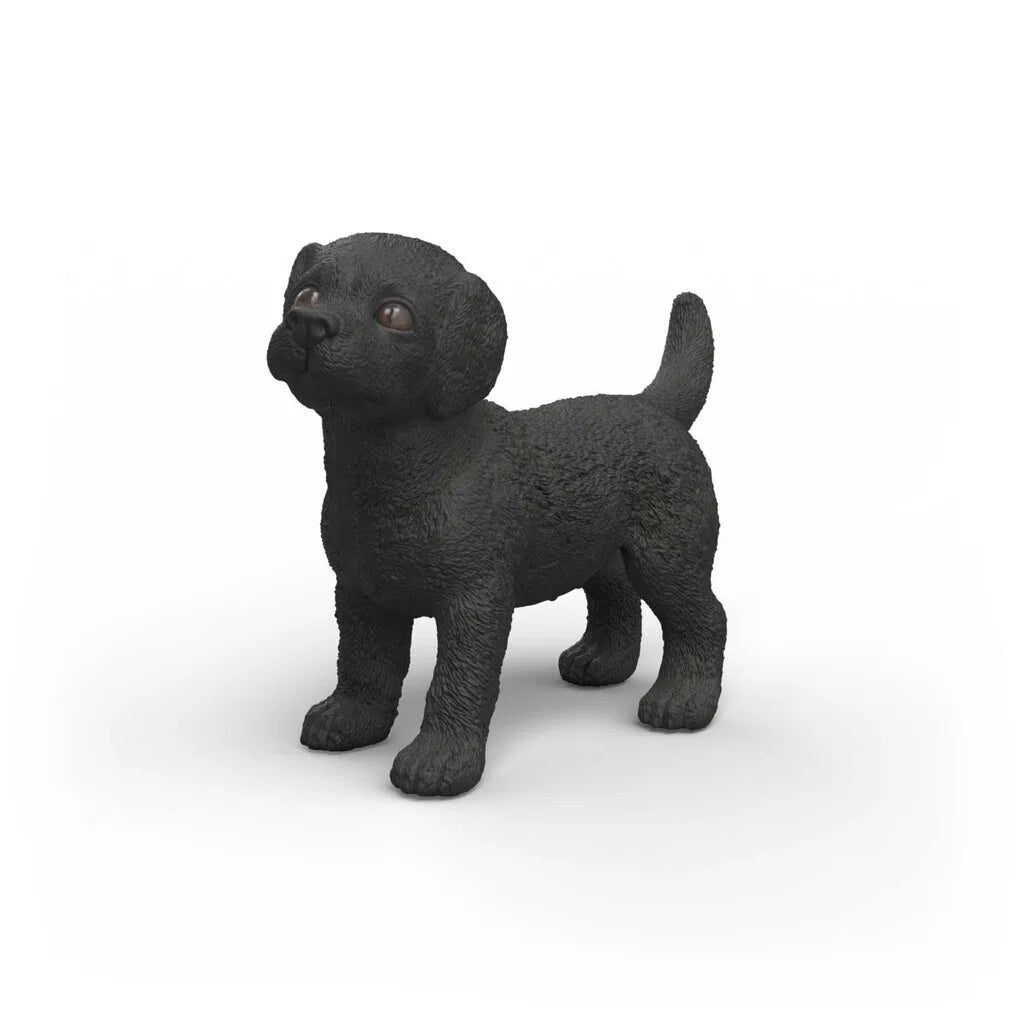 Schleich svart Labrador Retriever valp figur med svart päls och hängande öron, realistisk modell av labradorvalp.