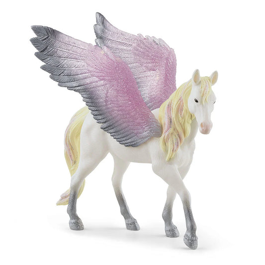 Schleich BAYALA Soluppgångens Pegasus med rosa man, gyllene detaljer och silverglänsande vingar i flygande pose.