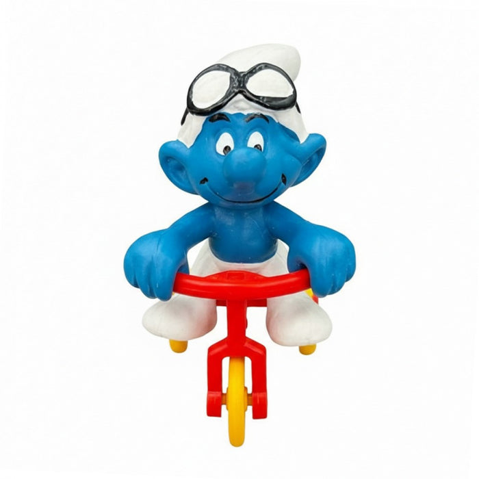 Schleich Super Smurf 40203 på trehjuling i originalförpackning från 1978, handmålad PVC-figur, vintage samlarobjekt.
